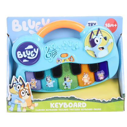 Voorkant verpakking van Bluey piano keyboard met vrolijke kleuren en figuren, kindvriendelijk muziek speelgoed.