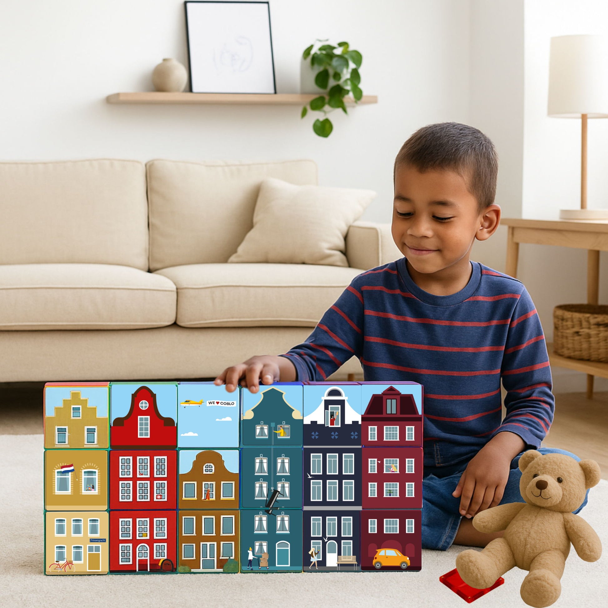 Jongen met Coblo magnetische tegels Little Amsterdam set bouwen speelgoed met magneten thuis