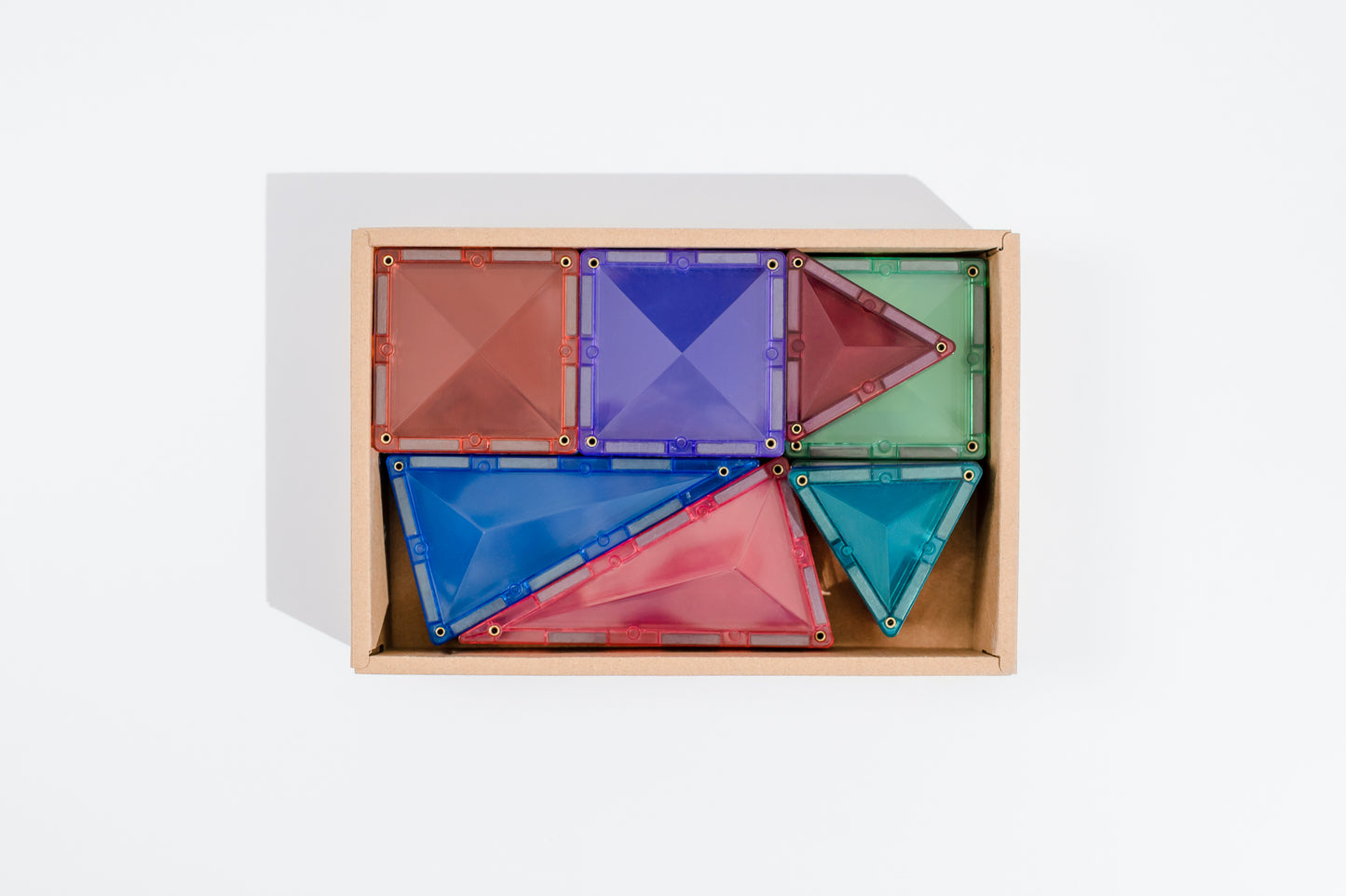 Connetix tiles bovenaanzicht open doos met driehoekige en vierkante magneet tegels pastel