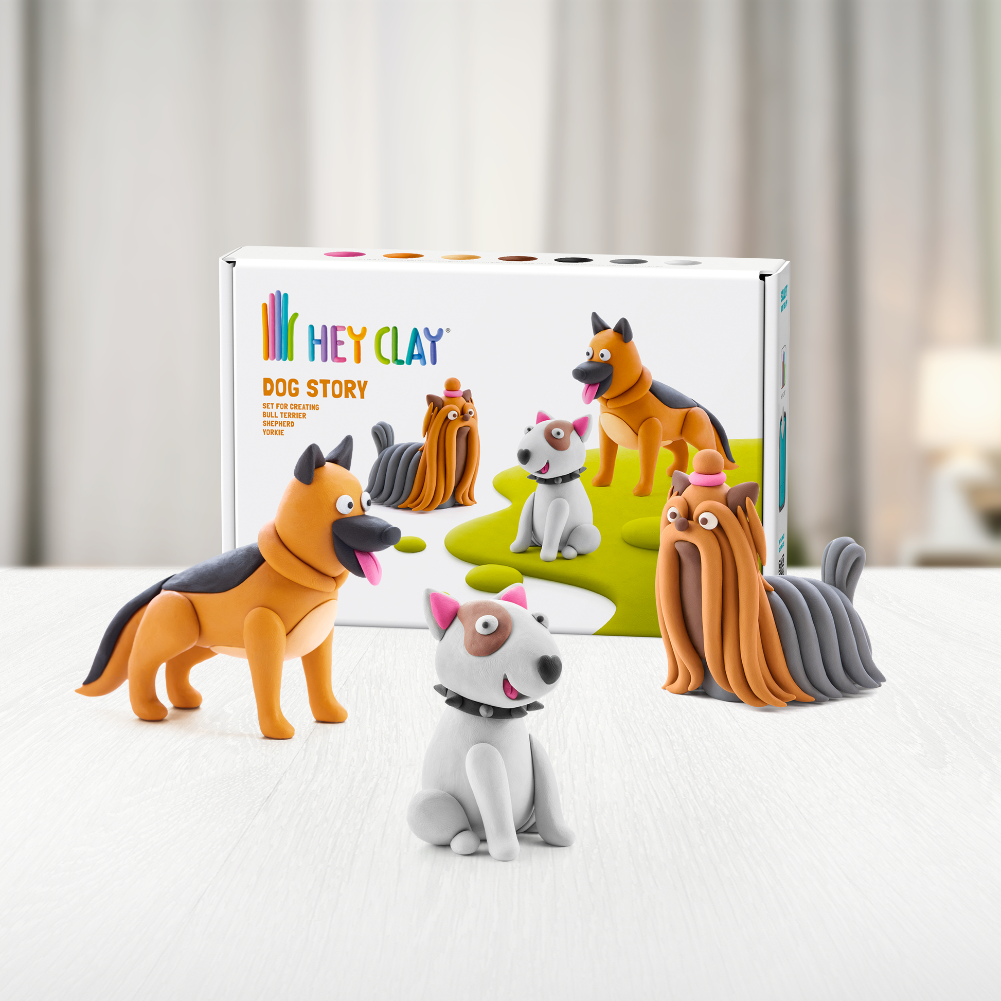 Hey Clay Dog Story verpakking met drie gekleurde hondenfiguren boetseerklei lifestyle foto