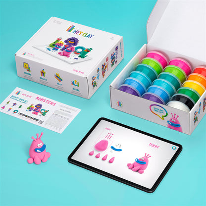Hey Clay Monsters complete inhoud bovenaanzicht: verpakking, 15 potjes boetseerklei, instructies en tablet