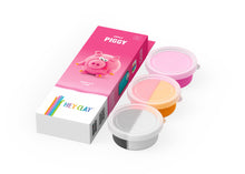 Hey Clay Piggy verpakking met 3 potjes boetseerklei in roze, oranje en grijs voor varkentje maken