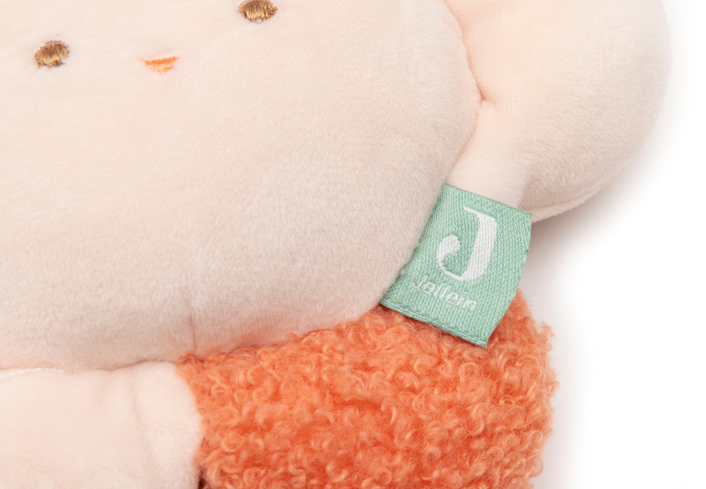 Detailfoto Jollein Muziekdoosje flower Pretty Picnic met zichtbaar Jollein-label en bouclé stof in zalm