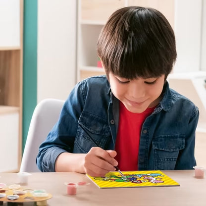 Kind schildert vrolijk Super Mario Ravensburger CreArt kunstwerk met Mario en Yoshi’s, leuk knutsel idee voor kinderen.