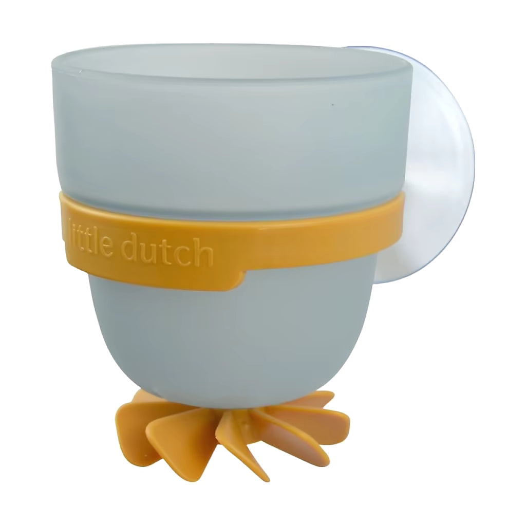 Close-up Little Dutch Badwand bekers zeester, blauwe beker met geel draaiwieltje onderaan, peuter speelgoed voor bad.