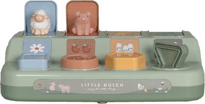 Little Dutch Farm Pop-up Dieren met schaap en varken zichtbaar, educatief babyspeelgoed in pastelgroene uitvoering.