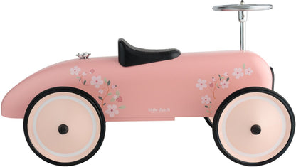 Loopauto Little Dutch roze profielaanzicht met bloemendecoratie en zwart lederen zadel