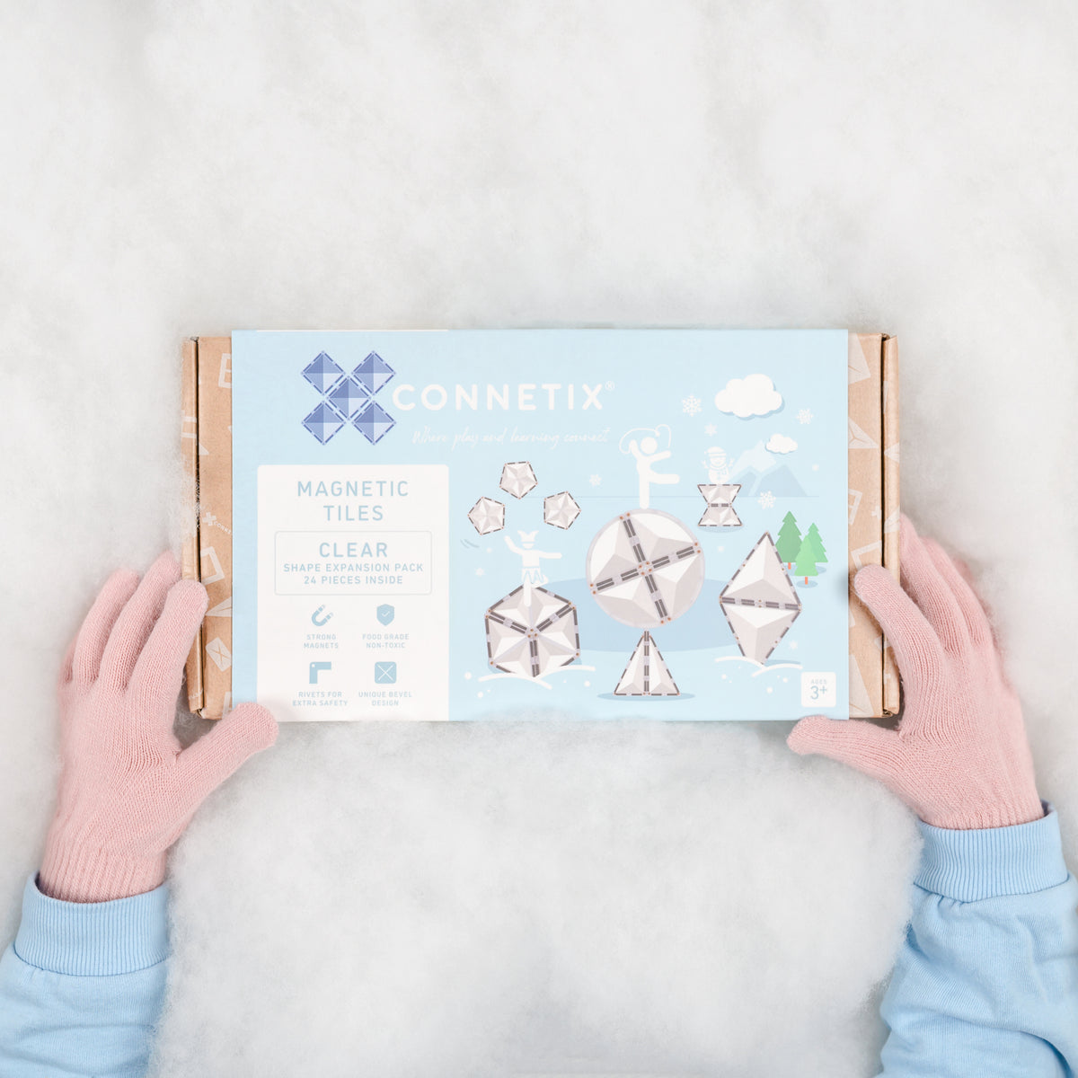 Magneet speelgoed Connetix Clear Shape Expansion Pack bovenkant doos met kinderhanden