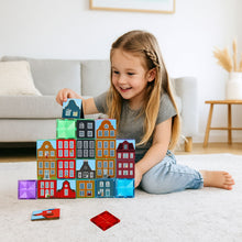 Meisje bouwt met Coblo magnetisch speelgoed Little Amsterdam grachtenhuizen op vloer thuis