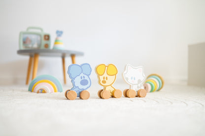 Montessori speelgoed set met houten Woezel en Pip duwfiguren en pastelkleurige regenboog