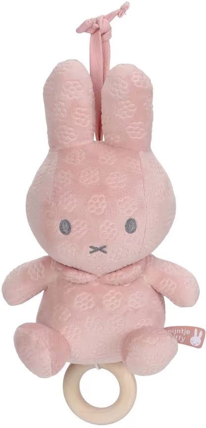 Muziekdoosje Nijntje in zacht roze pluche met bloemmotief, ideaal baby cadeau en sensorisch speelgoed.