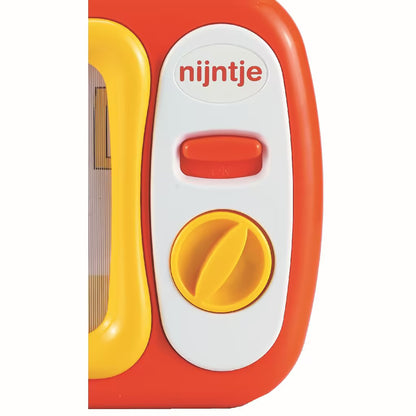 Detailfoto van Nijntje mijn eerste TV met rode schuifknop en gele draaischijf, stevig educatief speelgoed.