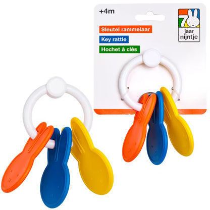 Nijntje Rammelaar sleutelbos in rood, blauw en geel, baby speelgoed op voorkant verpakking met logo en tekst.